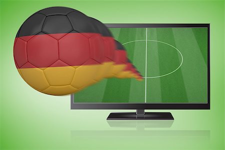 simsearch:400-07527960,k - Football in germany colours flying out of tv against green vignette Stock Photo - Budget Royalty-Free & Subscription, Code: 400-07527960