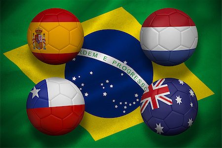 simsearch:400-07527966,k - Composite image of group b footballs for world cup against digitally generated brazilian national flag Foto de stock - Royalty-Free Super Valor e Assinatura, Número: 400-07527977