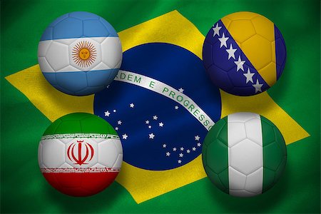 simsearch:400-04155683,k - Composite image of group f footballs for world cup against digitally generated brazilian national flag Stock Photo - Budget Royalty-Free & Subscription, Code: 400-07527979