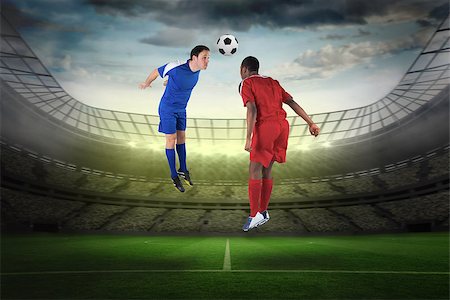 simsearch:400-07665266,k - Football players tackling for the ball against large football stadium with lights Stock Photo - Budget Royalty-Free & Subscription, Code: 400-07528020