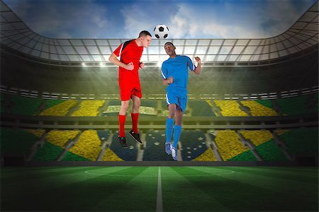 simsearch:400-07665266,k - Football players tackling for the ball against large football stadium with brasilian fans Stock Photo - Budget Royalty-Free & Subscription, Code: 400-07528021