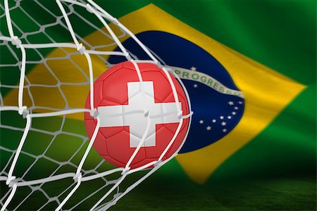 simsearch:400-07527966,k - Football in swiss colours at back of net against brazilian flag waving Foto de stock - Royalty-Free Super Valor e Assinatura, Número: 400-07528115