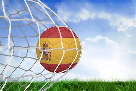 simsearch:858-03052829,k - Football in spain colours at back of net against field of grass under blue sky Fotografie stock - Microstock e Abbonamento, Codice: 400-07528132