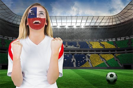 Excited chile fan in face paint cheering against large football stadium with brasilian fans Stock Photo - Budget Royalty-Free & Subscription, Code: 400-07528232