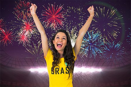 Excited football fan in brasil tshirt against fireworks exploding over football stadium Foto de stock - Super Valor sin royalties y Suscripción, Código: 400-07528247