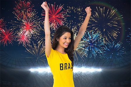 Excited football fan in brasil tshirt against fireworks exploding over football stadium Foto de stock - Super Valor sin royalties y Suscripción, Código: 400-07528248