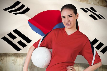 Smiling asian football fan looking at camera against  korea republic flag Stock Photo - Budget Royalty-Free & Subscription, Code: 400-07528284