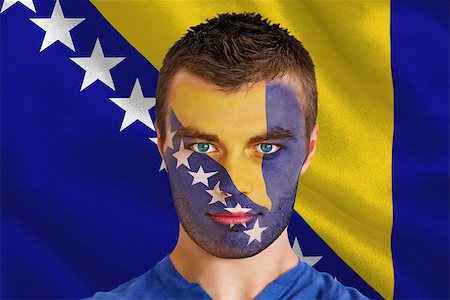 Composite image of serious young football fan in face paint against digitally generated bosnian flag Stock Photo - Budget Royalty-Free & Subscription, Code: 400-07528293