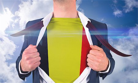 simsearch:400-07664375,k - Businessman opening shirt to reveal belgium flag against bright blue sky with clouds Foto de stock - Royalty-Free Super Valor e Assinatura, Número: 400-07528370