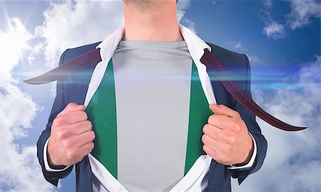 simsearch:400-07664375,k - Businessman opening shirt to reveal nigeria flag against bright blue sky with clouds Foto de stock - Royalty-Free Super Valor e Assinatura, Número: 400-07528380