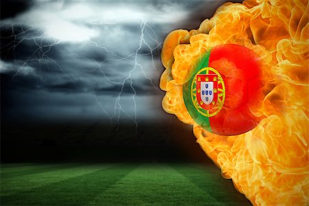 Composite image of fire surrounding portugal flag football against football pitch under stormy sky Stock Photo - Budget Royalty-Free & Subscription, Code: 400-07528494