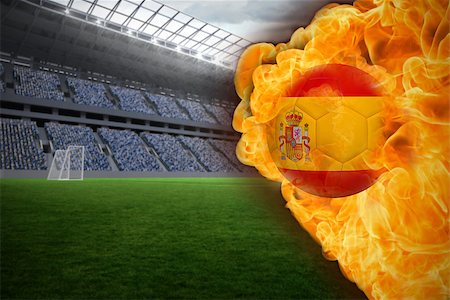 Composite image of fire surrounding spain flag football against vast football stadium with fans in blue Stock Photo - Budget Royalty-Free & Subscription, Code: 400-07528496