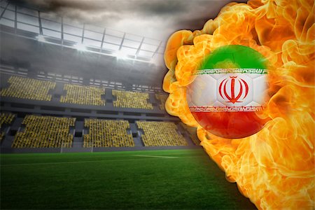 Composite image of fire surrounding iran flag football against large football stadium with lights Stock Photo - Budget Royalty-Free & Subscription, Code: 400-07528490