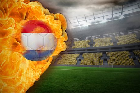 Composite image of fire surrounding dutch flag football against large football stadium with lights Stock Photo - Budget Royalty-Free & Subscription, Code: 400-07528493