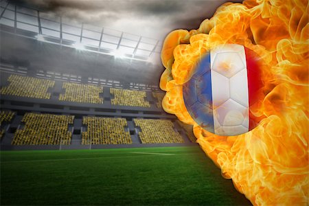 Composite image of fire surrounding france flag football against large football stadium with lights Stock Photo - Budget Royalty-Free & Subscription, Code: 400-07528507