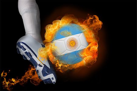 simsearch:400-07527966,k - Football player kicking flaming argentina flag ball against black Foto de stock - Royalty-Free Super Valor e Assinatura, Número: 400-07528518