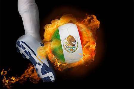 simsearch:400-07527960,k - Football player kicking flaming mexico ball against black Stock Photo - Budget Royalty-Free & Subscription, Code: 400-07528526