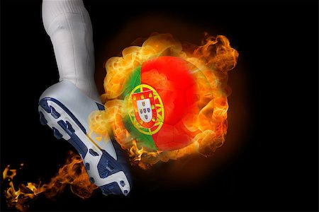 simsearch:400-07527960,k - Football player kicking flaming portugal ball against black Stock Photo - Budget Royalty-Free & Subscription, Code: 400-07528529