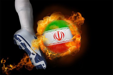 simsearch:400-07527960,k - Football player kicking flaming iran ball against black Stock Photo - Budget Royalty-Free & Subscription, Code: 400-07528522