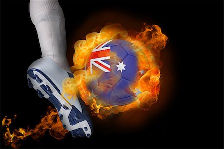 simsearch:400-07527960,k - Football player kicking flaming australia ball against black Stock Photo - Budget Royalty-Free & Subscription, Code: 400-07528536