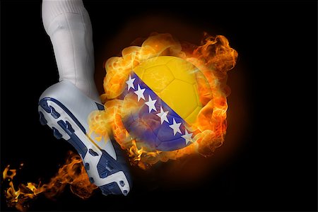 simsearch:400-07527960,k - Football player kicking flaming bosnia ball against black Stock Photo - Budget Royalty-Free & Subscription, Code: 400-07528538