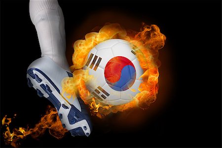 simsearch:400-07527960,k - Football player kicking flaming korea republic ball against black Stock Photo - Budget Royalty-Free & Subscription, Code: 400-07528531