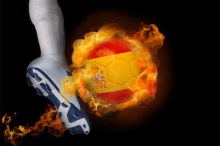 simsearch:400-07527960,k - Football player kicking flaming spain ball against black Stock Photo - Budget Royalty-Free & Subscription, Code: 400-07528532