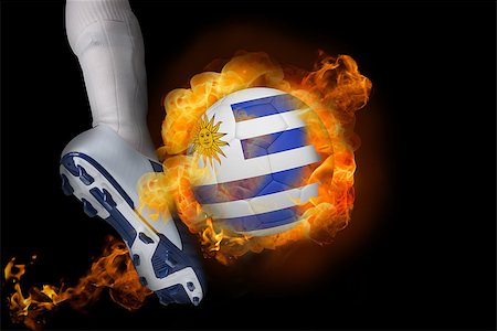 simsearch:400-07527966,k - Football player kicking flaming uruguay ball against black Foto de stock - Royalty-Free Super Valor e Assinatura, Número: 400-07528533