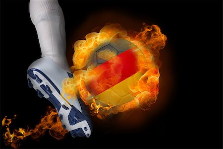 simsearch:400-07527960,k - Football player kicking flaming germany ball against black Stock Photo - Budget Royalty-Free & Subscription, Code: 400-07528544