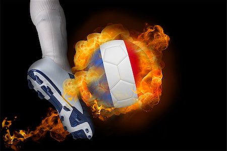 simsearch:400-07527960,k - Football player kicking flaming france ball against black Stock Photo - Budget Royalty-Free & Subscription, Code: 400-07528543