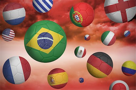 simsearch:400-07527966,k - Footballs in various flag colours  against red cloudy sky background Foto de stock - Royalty-Free Super Valor e Assinatura, Número: 400-07528628