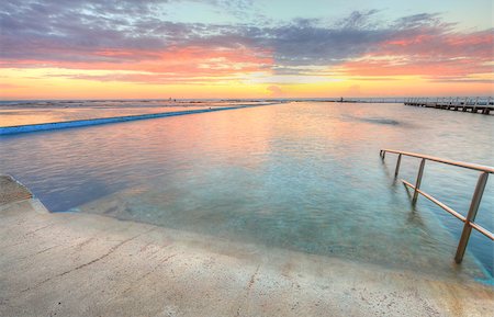 simsearch:400-07514503,k - Beautiful morning for a swim.  Sunrise from the Narrabeen Ocean Baths , North Narrabeen NSW Australia Stock Photo - Budget Royalty-Free & Subscription, Code: 400-07528904
