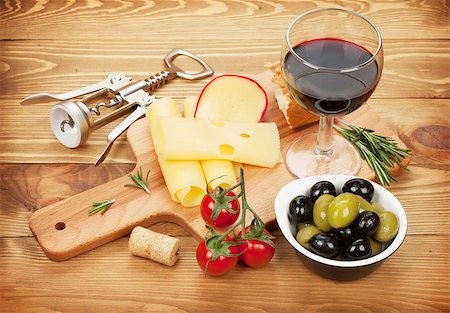 simsearch:400-07937807,k - Red wine with cheese, olives, bread, vegetables and spices on wooden table Photographie de stock - Aubaine LD & Abonnement, Code: 400-07545241