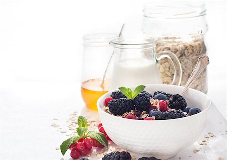 simsearch:400-08669360,k - Healthy breakfast with granola and fresh berries on white Stock Photo - Budget Royalty-Free & Subscription, Code: 400-07545496