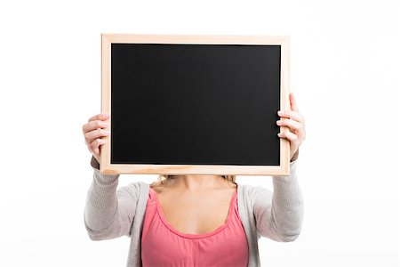 Beautiful woman holding  a chalkboard, isolated over white background Stock Photo - Budget Royalty-Free & Subscription, Code: 400-07545573