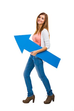 people carrying arrow - Beautiful woman walking while holding a blue arrow Stock Photo - Budget Royalty-Free & Subscription, Code: 400-07545584