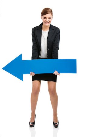 person holding up sign - Beautiful young business woman holding a blue arrow, over a white background Stock Photo - Budget Royalty-Free & Subscription, Code: 400-07545620