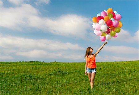 simsearch:400-08262183,k - Young beautiful woman with colorful balloons on a green meadow Stock Photo - Budget Royalty-Free & Subscription, Code: 400-07545656
