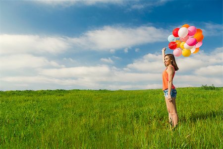 simsearch:400-06077546,k - Young beautiful woman with colorful balloons on a green meadow Stockbilder - Microstock & Abonnement, Bildnummer: 400-07545658