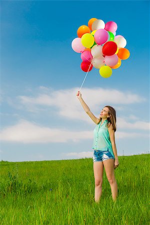 simsearch:400-08262183,k - Young beautiful woman with colorful balloons on a green meadow Stock Photo - Budget Royalty-Free & Subscription, Code: 400-07545662