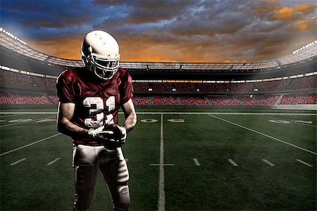 simsearch:6109-08389992,k - Football player with a red uniform, in a stadium with fans wearing red uniform Stock Photo - Budget Royalty-Free & Subscription, Code: 400-07545854