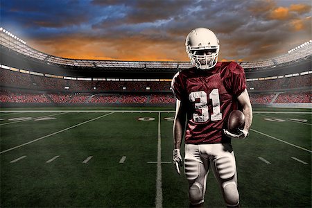 Football player with a red uniform, in a stadium with fans wearing red uniform Photographie de stock - Aubaine LD & Abonnement, Code: 400-07545853