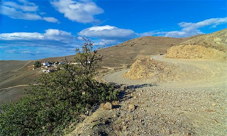 A sharp turn on a mountain road. Crimea, cape Meganom. Stock Photo - Budget Royalty-Free & Subscription, Code: 400-07548685