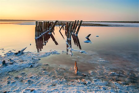 All objects in this lake covered with salt. Water contains minerals and so is multicolored. Stock Photo - Budget Royalty-Free & Subscription, Code: 400-07548744