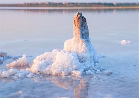 All objects in this lake covered with salt. Water contains minerals and so is multicolored. Stock Photo - Budget Royalty-Free & Subscription, Code: 400-07548741