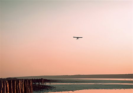 sunset small plane - The plane on a background of the sky Stock Photo - Budget Royalty-Free & Subscription, Code: 400-07548743