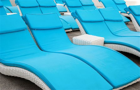 resort outdoor bed - empty beach couches at the beach Photographie de stock - Aubaine LD & Abonnement, Code: 400-07548756