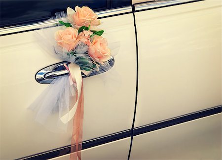 Door of white wedding car with flowers and white bow Stock Photo - Budget Royalty-Free & Subscription, Code: 400-07548759