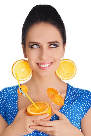 pop art of holding - Young woman with orange slice earrings holding a sliced orange with a straw on white background Stock Photo - Budget Royalty-Free & Subscription, Code: 400-07549499