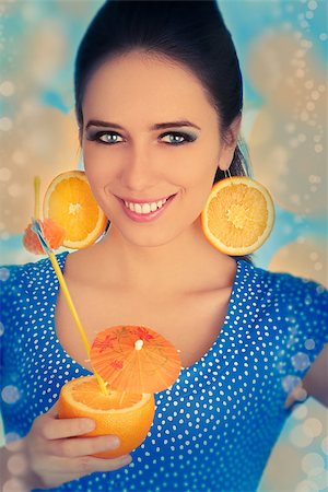 pop art of holding - Young woman with orange slice earrings holding a sliced orange with a straw, vintage portrait Stock Photo - Budget Royalty-Free & Subscription, Code: 400-07549493